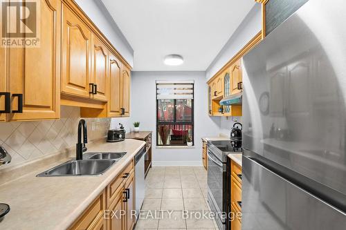 203 - 15390 Yonge Street, Aurora, ON - Indoor Photo Showing Kitchen With Double Sink