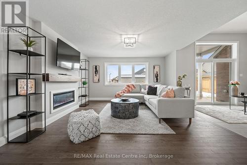 Photo is representation of Builders work - 218 Bridge Crescent, Minto, ON - Indoor Photo Showing Living Room With Fireplace