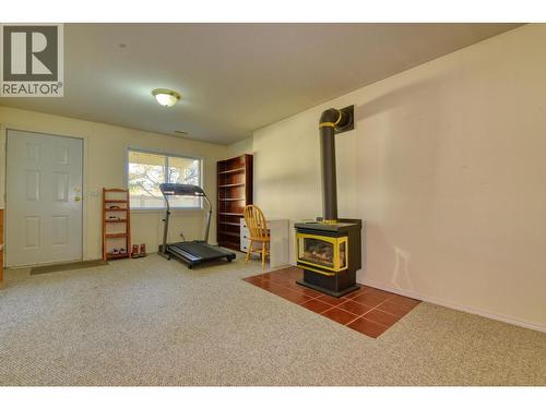 7 500 Wotzke Drive, Williams Lake, BC - Indoor Photo Showing Other Room With Fireplace