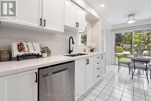 106 - 2555 Thomas Street, Mississauga, ON - Indoor Photo Showing Kitchen With Double Sink