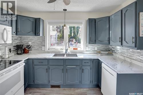 704 Leeville Drive, Assiniboia, SK - Indoor Photo Showing Kitchen With Double Sink