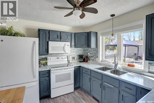 704 Leeville Drive, Assiniboia, SK - Indoor Photo Showing Kitchen With Double Sink