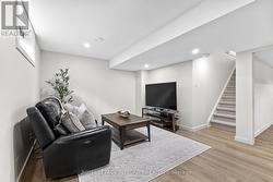 Finished basement w/ laminate flooring throughout - 