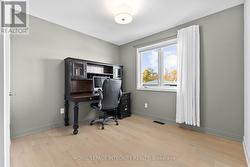 Spacious third bedroom with hardwood flooring - 