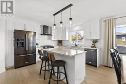 Quartz counters, extended cabinets to ceiling - 