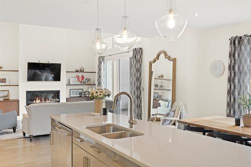 18-1395 Prairie Rose Drive, Kamloops, BC - Indoor Photo Showing Kitchen With Fireplace With Double Sink
