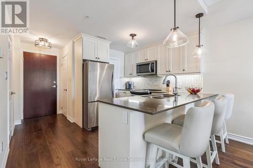 202 - 70 Stewart Street, Oakville (Co Central), ON - Indoor Photo Showing Kitchen With Stainless Steel Kitchen With Double Sink