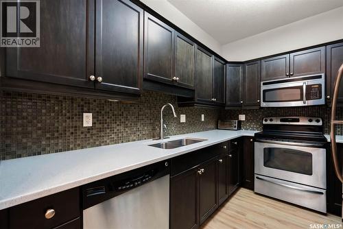 105 W 1300 Stockton Street N, Regina, SK - Indoor Photo Showing Kitchen With Stainless Steel Kitchen With Double Sink