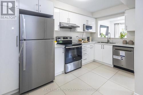 36 - 5255 Guildwood Way, Mississauga, ON - Indoor Photo Showing Kitchen With Stainless Steel Kitchen With Double Sink