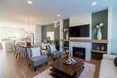 599 Ken Oblik Drive, Winnipeg, MB  - Indoor Photo Showing Living Room With Fireplace 