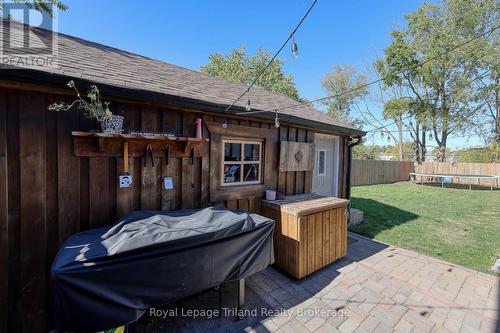 Side of Garage and patio - 661 Henry Street, Woodstock (Woodstock - South), ON - Outdoor With Deck Patio Veranda