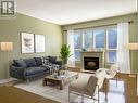 Virtually Staged - 132 Loretta Drive, Niagara-On-The-Lake (Virgil), ON  - Indoor Photo Showing Living Room With Fireplace 