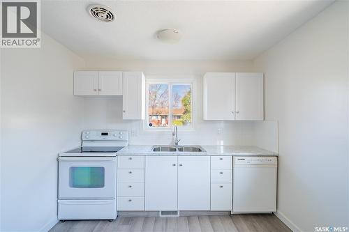 3111 Dewdney Avenue E, Regina, SK - Indoor Photo Showing Kitchen With Double Sink