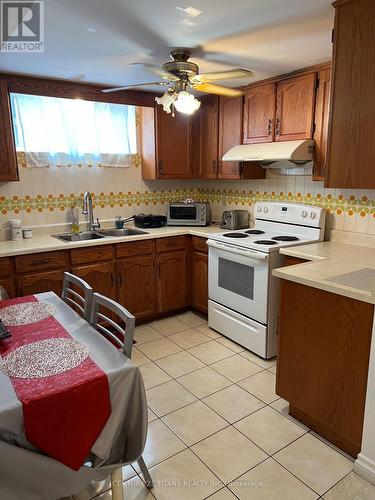 Bsmt-R1 - 57 Milady Road, Toronto, ON - Indoor Photo Showing Kitchen With Double Sink