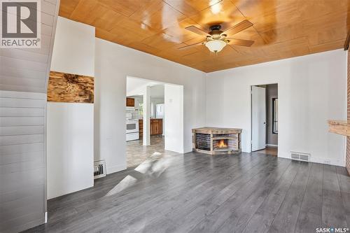 450 Charles Street, Asquith, SK - Indoor Photo Showing Living Room With Fireplace