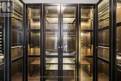 Main BR  Custom Cabinets In First Walk In Closet - 