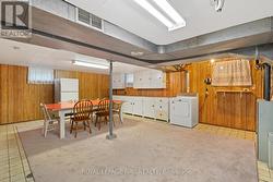 Large utility room with table and cabinets - 