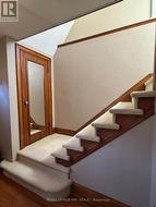 Front entrance closet and staircase to 2nd floor - 