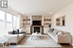 Family Room w/ Gas Fireplace and Built-in shelving - 