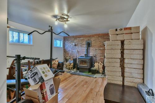 Family room - 344 Rue Mitchell, Lachute, QC - Indoor Photo Showing Other Room With Fireplace