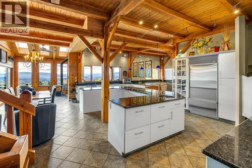 Kitchen Island and Eat up Bar - 5705 Upper Booth N Road, Kelowna, BC - Indoor Photo Showing Kitchen