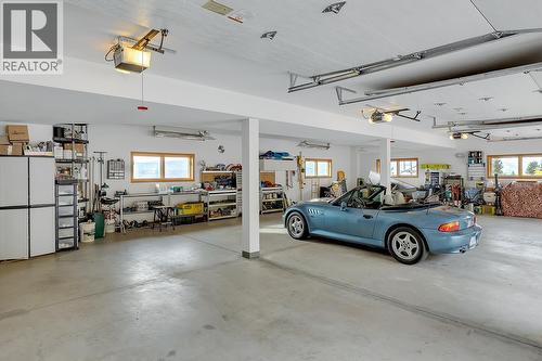 Oversized Garage with a lower level the same size as above.  Great for the car collector etc. - 5705 Upper Booth N Road, Kelowna, BC - Indoor Photo Showing Garage