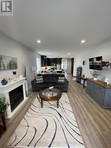 2 - 255 Albert Street, Huron East (Brussels), ON - Indoor Photo Showing Living Room With Fireplace