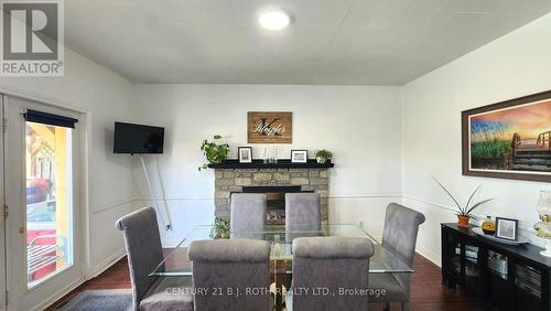1252 Shore Acres Drive, Innisfil, ON - Indoor Photo Showing Dining Room With Fireplace