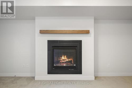 534 Corretto Place, Ottawa, ON - Indoor Photo Showing Living Room With Fireplace