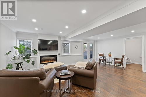 Walk Out to Backyard - 43 Valleyscape Trail, Caledon, ON - Indoor Photo Showing Living Room With Fireplace
