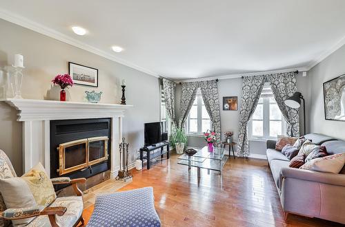 Living room - 6 Rue Des Doublons, Blainville, QC - Indoor Photo Showing Living Room With Fireplace