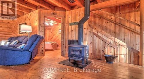30 Mcvittie Island, Bracebridge (Monck (Bracebridge)), ON - Indoor Photo Showing Other Room With Fireplace