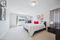 Carpeted bedroom featuring a textured ceiling - 