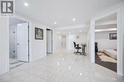 Hallway featuring light marble finish flooring and recessed lighting - 