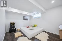 Bedroom with wood finished floors and recessed lighting - 