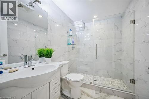 Full bath with a marble finish shower, vanity, tile walls, marble finish floors, and recessed lighting - 598 Sundew Drive, Waterloo, ON - Indoor Photo Showing Bathroom