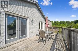 Wooden deck featuring outdoor dining area - 