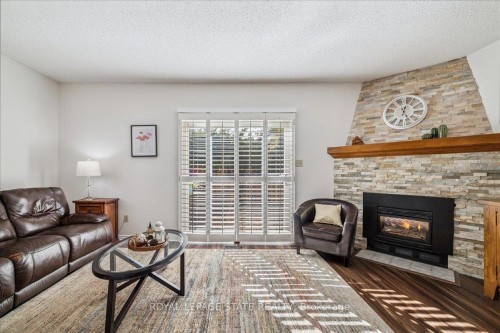 5-15 Ellington Avenue, Hamilton, ON - Indoor Photo Showing Living Room With Fireplace