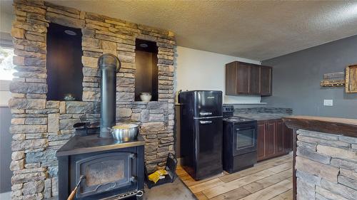 303 5Th Street, Cranbrook, BC - Indoor Photo Showing Living Room With Fireplace