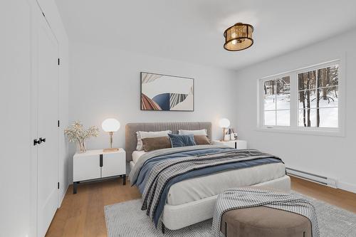 Primary bedroom - Rue Paulsen, Sainte-Agathe-Des-Monts, QC - Indoor Photo Showing Bedroom