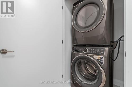 #8 - 30 Dean Park Road, Toronto, ON - Indoor Photo Showing Laundry Room