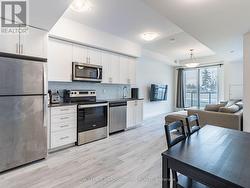 Kitchen with stainless steel appliances - 