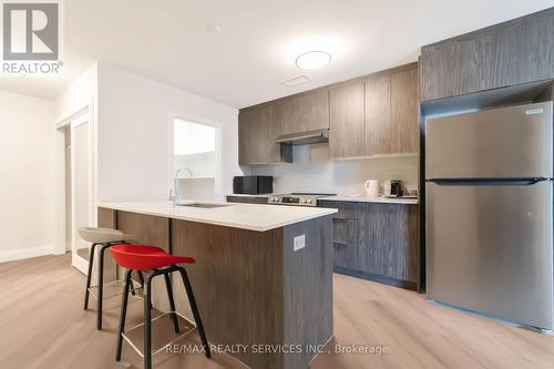 #7 - 30 Dean Park Road, Toronto, ON - Indoor Photo Showing Kitchen With Upgraded Kitchen