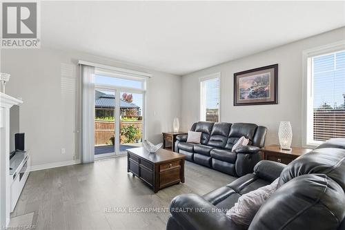 Sliding doors to backyard patio and pergola - 4 Ellis Avenue, St. Catharines, ON - Indoor Photo Showing Living Room