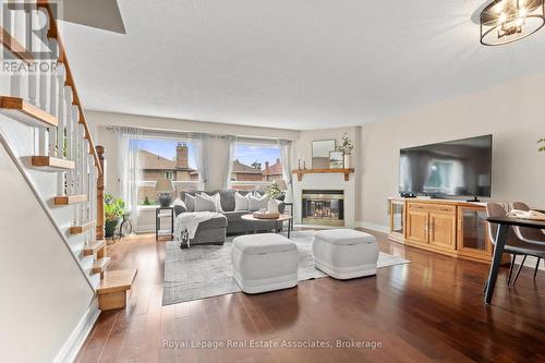 7 - 4605 Donegal Drive, Mississauga, ON - Indoor Photo Showing Living Room With Fireplace