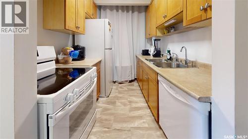 401 4045 Rae Street, Regina, SK - Indoor Photo Showing Kitchen With Double Sink