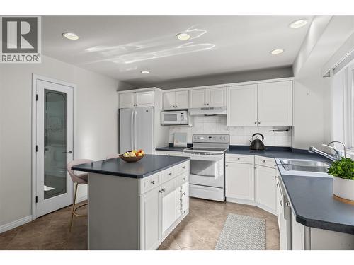 Kitchen- Virtually staged photo - 1188 Houghton Road Unit# 104, Kelowna, BC - Indoor Photo Showing Kitchen