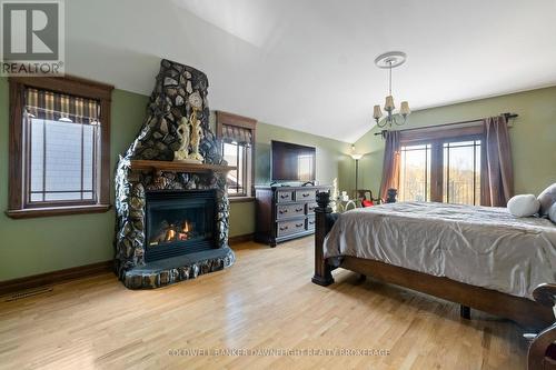 246 Hazelton Lane, South Huron (Exeter), ON - Indoor Photo Showing Bedroom With Fireplace
