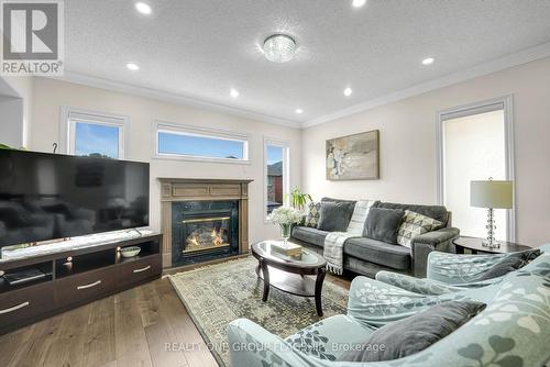 1128 Knotty Pine Grove, Mississauga, ON - Indoor Photo Showing Living Room With Fireplace