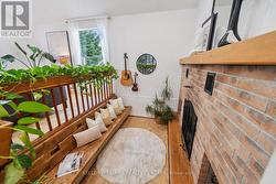 Sunken seating area with a wood-burning fireplace. - 